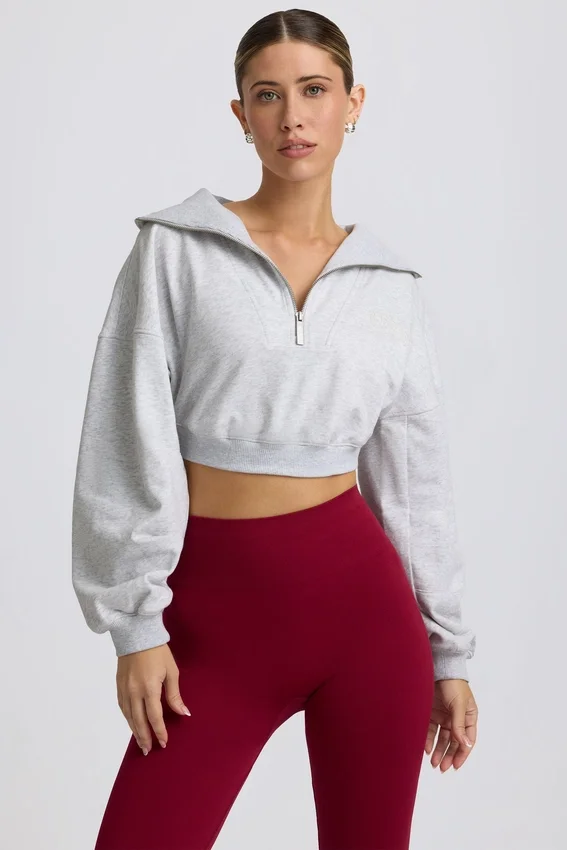 Kort sweatshirt med kvartslång dragkedja i gråmelerat Kort sweatshirt med kvartslång dragkedja i gråmelerat