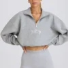 Kort sweatshirt med kvartslång dragkedja i gråmelerat Kort sweatshirt med kvartslång dragkedja i gråmelerat