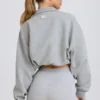 Kort sweatshirt med kvartslång dragkedja i gråmelerat Kort sweatshirt med kvartslång dragkedja i gråmelerat