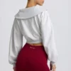 Kort sweatshirt med kvartslång dragkedja i gråmelerat Kort sweatshirt med kvartslång dragkedja i gråmelerat