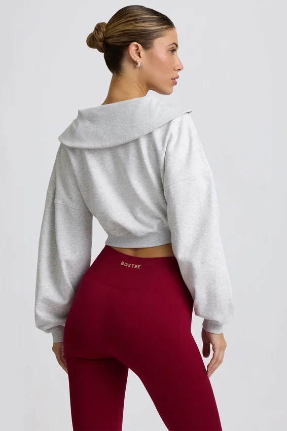 Kort sweatshirt med kvartslång dragkedja i gråmelerat Kort sweatshirt med kvartslång dragkedja i gråmelerat