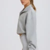 Kort sweatshirt med kvartslång dragkedja i gråmelerat Kort sweatshirt med kvartslång dragkedja i gråmelerat