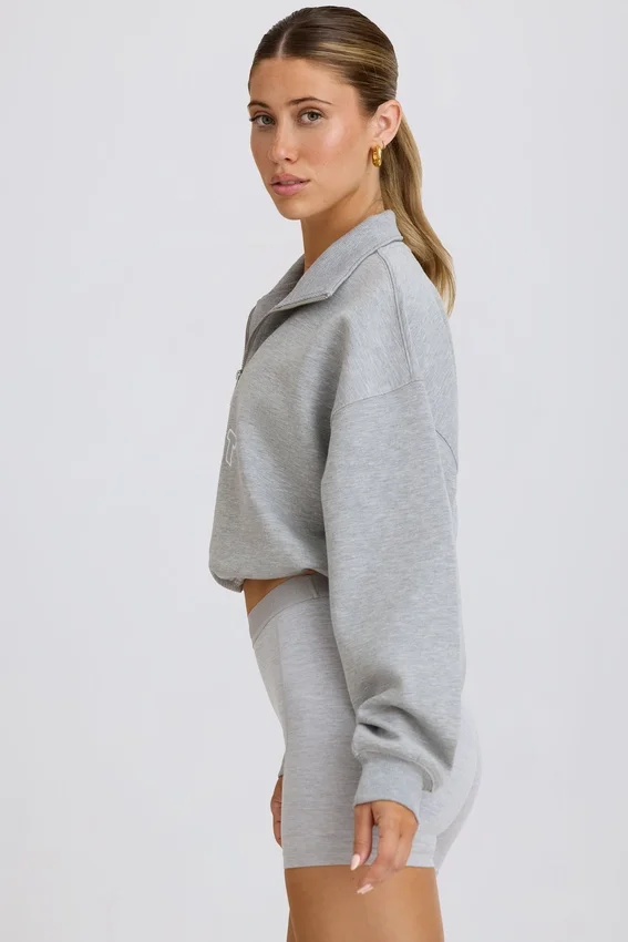 Kort sweatshirt med kvartslång dragkedja i gråmelerat Kort sweatshirt med kvartslång dragkedja i gråmelerat