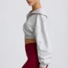 Kort sweatshirt med kvartslång dragkedja i gråmelerat Kort sweatshirt med kvartslång dragkedja i gråmelerat