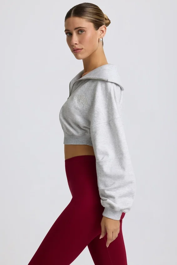 Kort sweatshirt med kvartslång dragkedja i gråmelerat Kort sweatshirt med kvartslång dragkedja i gråmelerat