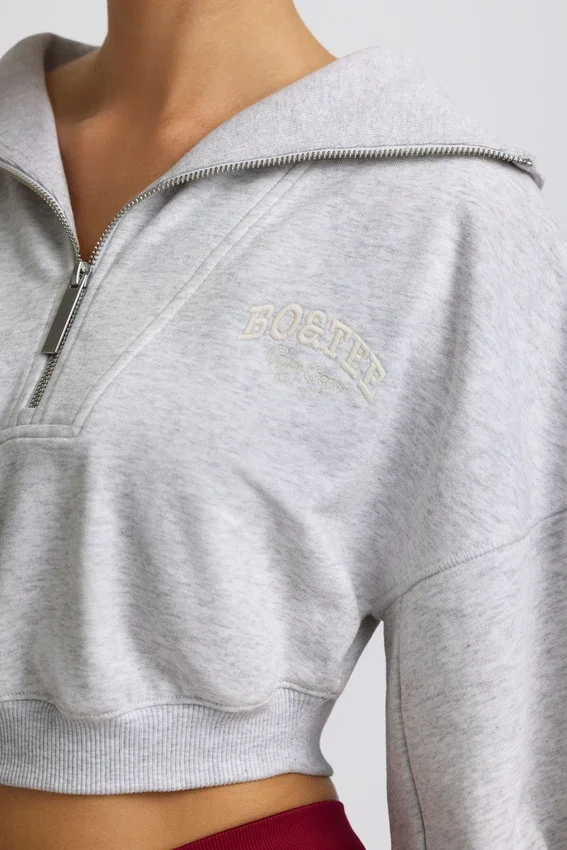 Kort sweatshirt med kvartslång dragkedja i gråmelerat Kort sweatshirt med kvartslång dragkedja i gråmelerat