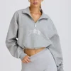 Kort sweatshirt med kvartslång dragkedja i gråmelerat Kort sweatshirt med kvartslång dragkedja i gråmelerat