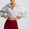 Kort sweatshirt med kvartslång dragkedja i gråmelerat Kort sweatshirt med kvartslång dragkedja i gråmelerat