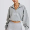 Kort sweatshirt med kvartslång dragkedja i gråmelerat Kort sweatshirt med kvartslång dragkedja i gråmelerat