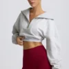 Kort sweatshirt med kvartslång dragkedja i gråmelerat Kort sweatshirt med kvartslång dragkedja i gråmelerat