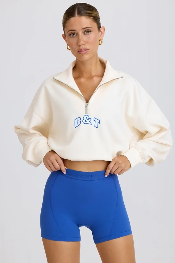 Kort sweatshirt med kvartslås i vitt Kort sweatshirt med kvartslås i vitt