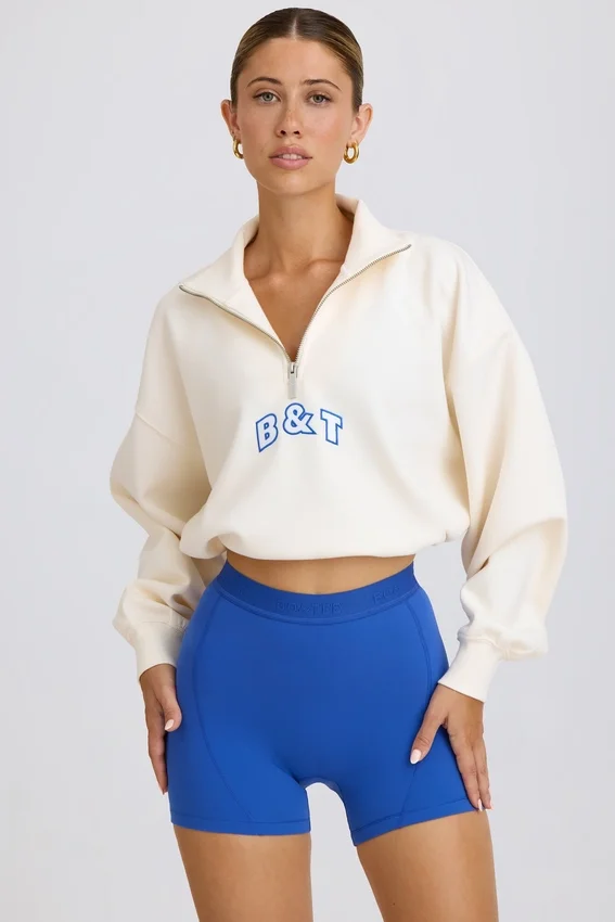 Kort sweatshirt med kvartslås i vitt Kort sweatshirt med kvartslås i vitt