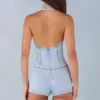Lalita knäppt playsuit med halterneck i ljus denim Lalita knäppt playsuit med halterneck i ljus denim