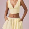 Magda crop top med rosettdetalj i citrongula ränder Magda crop top med rosettdetalj i citrongula ränder