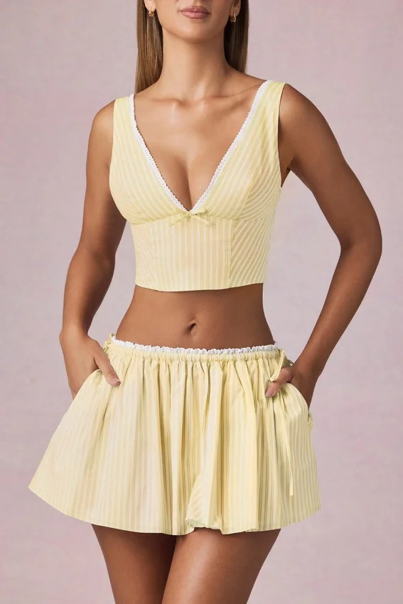 Magda crop top med rosettdetalj i citrongula ränder Magda crop top med rosettdetalj i citrongula ränder