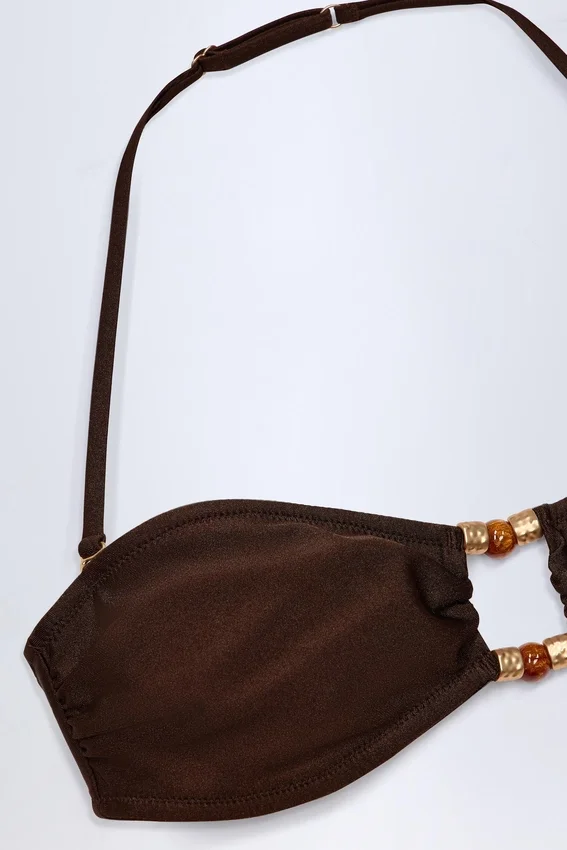 Manava bandeau-bikinitopp med pärlbroderi i mörk choklad Manava bandeau-bikinitopp med pärlbroderi i mörk choklad