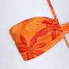 Maranta baddräkt med utskärningar och halterneck i orange orkidé-mönster Maranta baddräkt med utskärningar och halterneck i orange orkidé-mönster