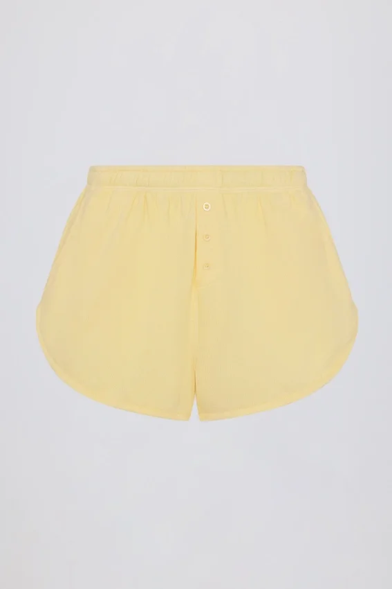 Midjehöga shorts med knappdetaljer i citrongult Midjehöga shorts med knappdetaljer i citrongult