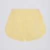 Midjehöga shorts med knappdetaljer i citrongult Midjehöga shorts med knappdetaljer i citrongult