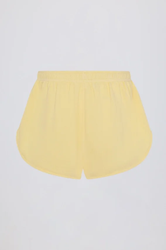 Midjehöga shorts med knappdetaljer i citrongult Midjehöga shorts med knappdetaljer i citrongult
