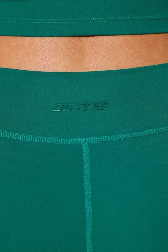 Mini-shorts med vridet midjeband och fickor i blågrönt Mini-shorts med vridet midjeband och fickor i blågrönt