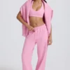 Mjuka joggingbyxor i bomullsjersey med medelhög midja och vida ben i babyrosa Mjuka joggingbyxor i bomullsjersey med medelhög midja och vida ben i babyrosa
