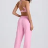 Mjuka joggingbyxor i bomullsjersey med medelhög midja och vida ben i babyrosa Mjuka joggingbyxor i bomullsjersey med medelhög midja och vida ben i babyrosa