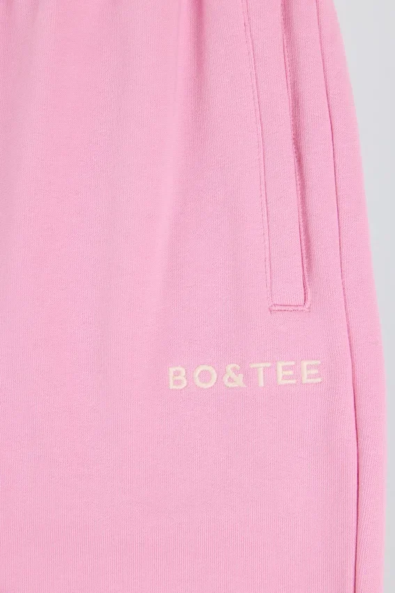 Mjuka joggingbyxor i bomullsjersey med medelhög midja och vida ben i babyrosa Mjuka joggingbyxor i bomullsjersey med medelhög midja och vida ben i babyrosa