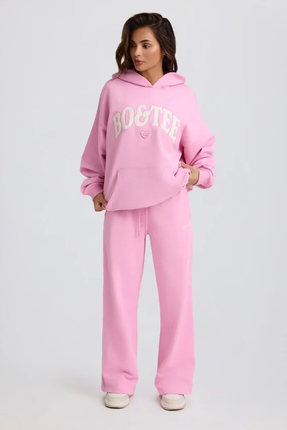 Mjuka joggingbyxor i bomullsjersey med medelhög midja och vida ben i babyrosa Mjuka joggingbyxor i bomullsjersey med medelhög midja och vida ben i babyrosa