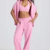 Mjuka joggingbyxor i bomullsjersey med medelhög midja och vida ben i babyrosa Mjuka joggingbyxor i bomullsjersey med medelhög midja och vida ben i babyrosa
