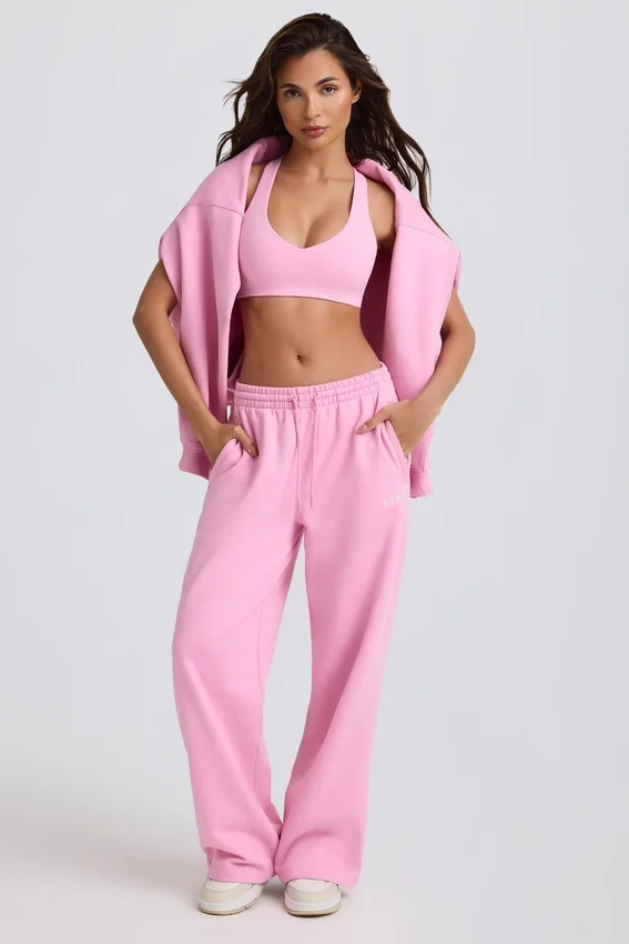 Mjuka joggingbyxor i bomullsjersey med medelhög midja och vida ben i babyrosa Mjuka joggingbyxor i bomullsjersey med medelhög midja och vida ben i babyrosa