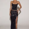 Nevara Embellished Mid-Rise Thigh-Split Maxi Kjol i svartlila Nevara Embellished Mid-Rise Thigh-Split Maxi Kjol i svartlila