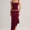 Niva Modal asymmetrisk midilång kjol med låg midja i vinrött Niva Modal asymmetrisk midilång kjol med låg midja i vinrött