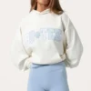 Oversized hoodie med applikation i färgen Milk Oversized hoodie med applikation i färgen Milk