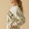 Oversized tröja med rund hals i benvit Oversized tröja med rund hals i benvit