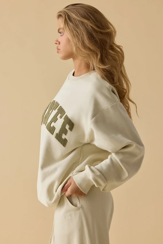 Oversized tröja med rund hals i benvit Oversized tröja med rund hals i benvit