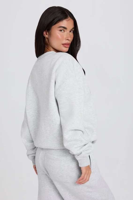 Oversized tröja med rund hals i gråmelerat Oversized tröja med rund hals i gråmelerat