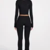 Philippa Modal Mid-Rise Flared Trousers i svart Philippa Modal Mid-Rise Flared Trousers i svart