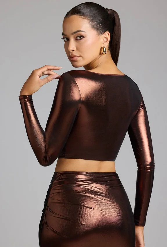 Rana crop top i metalliskt jersey med djup urringning i kopparbrons Rana crop top i metalliskt jersey med djup urringning i kopparbrons