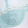 Ravello bikinitopp med bygel och balconette-modell i broderie anglaise i puderblått Ravello bikinitopp med bygel och balconette-modell i broderie anglaise i puderblått