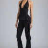 Reese Metallic Ruffle Low-Rise Flared Trousers i svart Reese Metallic Ruffle Low-Rise Flared Trousers i svart