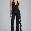 Reese Metallic Ruffle Low-Rise Flared Trousers i svart Reese Metallic Ruffle Low-Rise Flared Trousers i svart