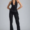 Reese Metallic Ruffle Low-Rise Flared Trousers i svart Reese Metallic Ruffle Low-Rise Flared Trousers i svart
