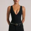 Rumi Deep Plunge Halterneck Bodys i svart Rumi Deep Plunge Halterneck Bodys i svart