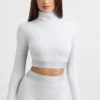 Rygglös långärmad crop top med hög hals i gråmelerad Rygglös långärmad crop top med hög hals i gråmelerad