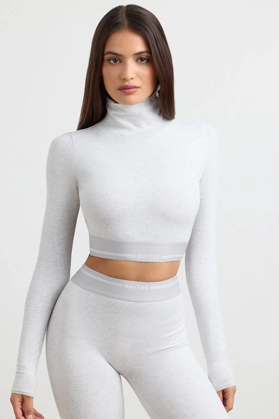 Rygglös långärmad crop top med hög hals i gråmelerad Rygglös långärmad crop top med hög hals i gråmelerad