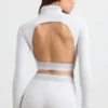 Rygglös långärmad crop top med hög hals i gråmelerad Rygglös långärmad crop top med hög hals i gråmelerad