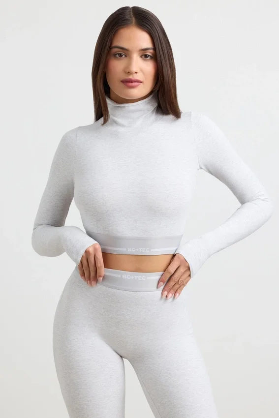 Rygglös långärmad crop top med hög hals i gråmelerad Rygglös långärmad crop top med hög hals i gråmelerad
