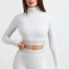 Rygglös långärmad crop top med hög hals i gråmelerad Rygglös långärmad crop top med hög hals i gråmelerad