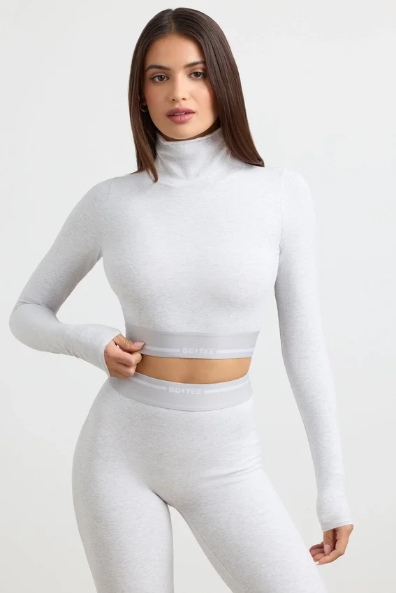 Rygglös långärmad crop top med hög hals i gråmelerad Rygglös långärmad crop top med hög hals i gråmelerad